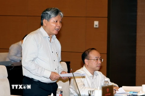 Bộ trưởng Bộ Tư pháp Hà Hùng Cường phát biểu ý kiến. (Ảnh: Phạm Kiên/TTXVN)