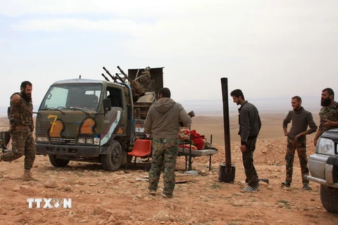 Binh sỹ Syria tại làng Jihar sau chiến dịch truy quét ngày 8/3. (Nguồn: AFP/TTXVN)