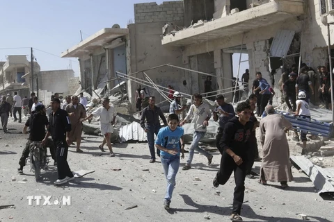 Hiện trường đổ nát do xung đột tại làng Kafruma, tỉnh Idlib ngày 24/9. (Nguồn: Reuters/TTXVN)