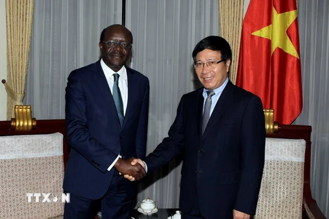 Phó Thủ tướng, Bộ trưởng Bộ Ngoại giao Phạm Bình Minh tiếp ông Mukhisa Kituyi, Tổng thư ký UNCTAD đang thăm và làm việc tại Việt Nam. (Ảnh: Phạm Kiên/TTXVN)