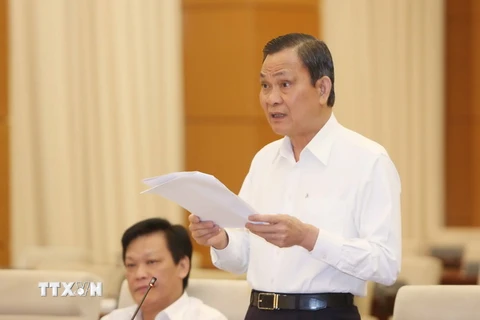 Bộ trưởng Bộ Nội vụ Nguyễn Thái Bình trình bày tờ trình. (Ảnh: Phương Hoa/TTXVN)