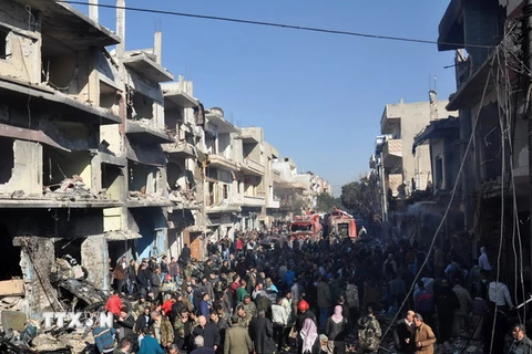 Hiện trường vụ đánh bom xe ở Homs. (Nguồn: AFP/TTXVN)