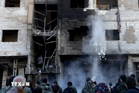 Hiện trường vụ đánh bom kép tại Syria. (Nguồn: AFP/TTXVN)