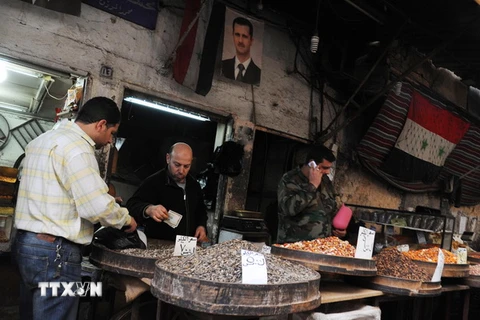 gười dân Syria được trở lại hoạt động thường nhật hàng ngày tại Damascus ngày 27/2, sau khi lệnh ngừng bắn có hiệu lực. (Nguồn: THX/TTXVN)