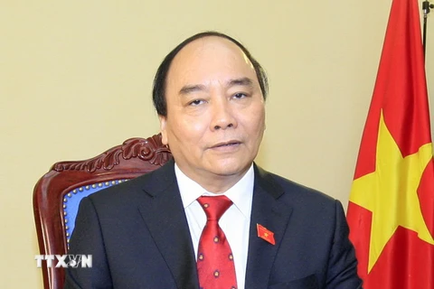 Ông Nguyễn Xuân Phúc, Ủy viên Bộ Chính trị, Thủ tướng Chính phủ trả lời phỏng vấn Thông tấn xã Việt Nam và các cơ quan báo chí. (Ảnh: Thống Nhất/TTXVN)