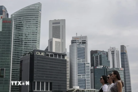 Các tòa nhà tại trung tâm tài chính của Singapore ngày 23/6. (Nguồn: EPA/TTXVN)