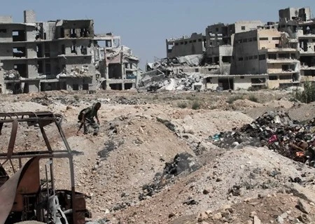 Nhà cửa bị phá hủy tại thành phố Aleppo, miền bắc Syria ngày 12/9. (Nguồn: THX/TTXVN)