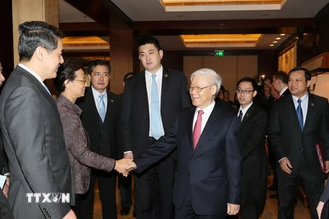 Tổng Bí thư Nguyễn Phú Trọng với các đại biểu tại cuộc gặp gỡ. (Ảnh: Trí Dũng/TTXVN)