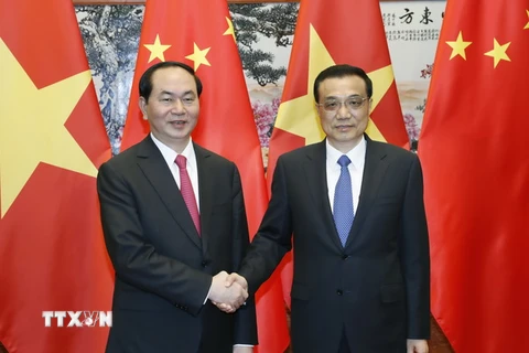Chủ tịch nước Trần Đại Quang gặp Thủ tướng Trung Quốc Lý Khắc Cường. (Ảnh: Nhan Sáng/TTXVN)