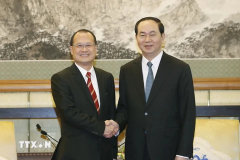 Chủ tịch nước Trần Đại Quang tiếp Chủ tịch Tập đoàn Sunwa Hong Kong. (Ảnh: Nhan Sáng/TTXVN)