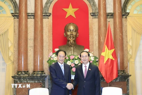 Chủ tịch nước Trần Đại Quang tiếp Xã trưởng Tân Hoa xã Thái Danh Chiếu nhân chuyến thăm và làm việc tại Việt Nam. (Ảnh: Nhan Sáng/TTXVN)