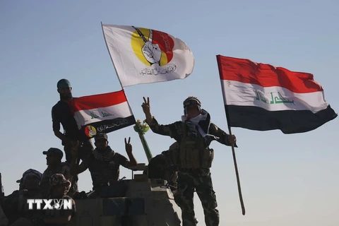 Các lực lượng Iraq tiến vào Tal Afar trong chiến dịch giải phóng khu vực này từ phiến quân IS ngày 20/8. (Nguồn: AFP/TTXVN)