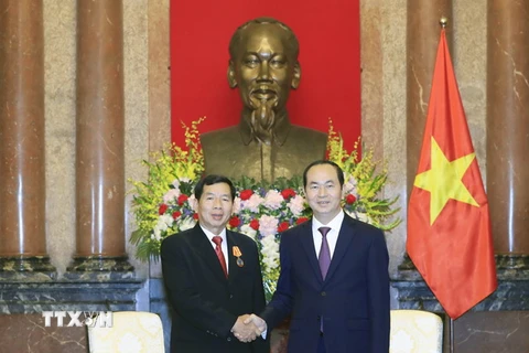Chủ tịch nước Trần Đại Quang tiếp Chánh án Tòa án nhân dân tối cao Lào Kham Phanh Sit Thi Dam Pha đang có chuyến thăm và làm việc tại Việt Nam. (Ảnh: Nhan Sáng/TTXVN.)