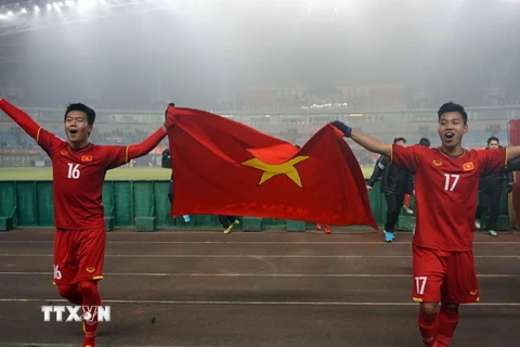 Niềm vui của các cầu thủ đội U23 Việt Nam khi giành quyền vào Bán kết U23 châu Á 2018. (Ảnh: Hoàng Linh/TTXVN)
