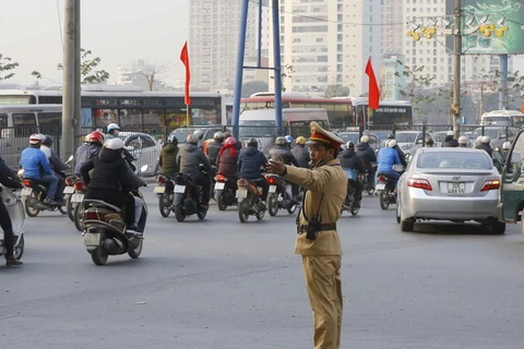 Cảnh sát giao thông Hà Nội làm nhiệm vụ tại khu vực phía Nam Hà Nội. (Ảnh: Doãn Tấn/TTXVN)