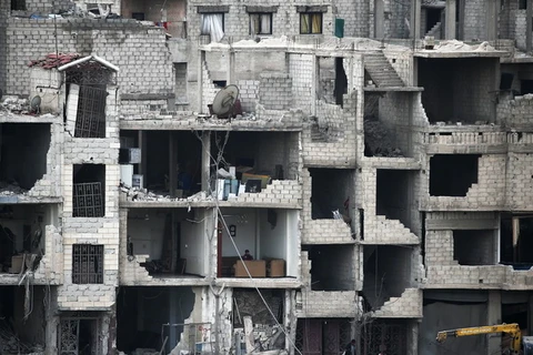Cảnh đổ nát do xung đột tại Đông Ghouta, Syria ngày 25/2. (Nguồn: AFP/TTXVN)