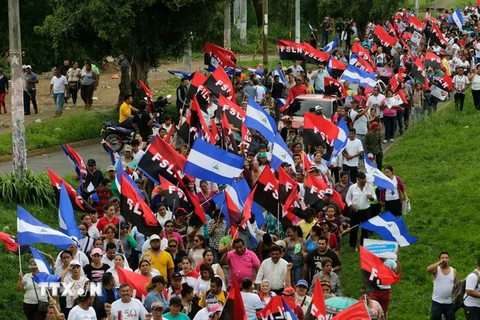 Người dân Nicaragua tham gia cuộc tuần hành vì an ninh và hòa bình tại Managua ngày 7/7. (Nguồn: AFP/TTXVN)