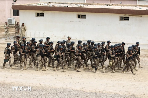 Lực lượng chống khủng bố của Iraq tham gia buổi huấn luyện tại thủ đô Baghdad ngày 19/3. (Ảnh: AFP/TTXVN)