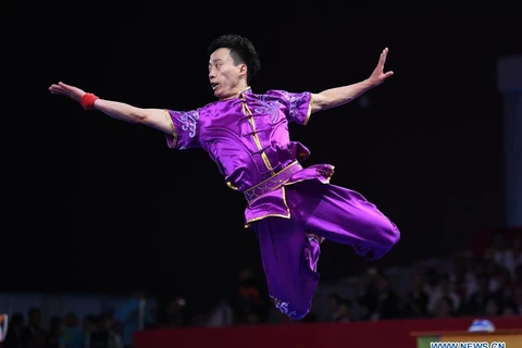 Bài thi đấu của ngôi sao wushu Trung Quốc Sun Peiyuan. (Nguồn: xinhuanet.com)