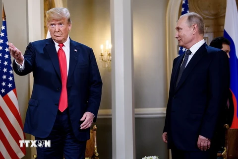 Tổng thống Mỹ Donald Trump (trái) và Tổng thống Nga Vladimir Putin tại cuộc gặp thượng đỉnh ở Helsinki, Phần Lan ngày 16/7. (Nguồn: AFP/TTXVN)