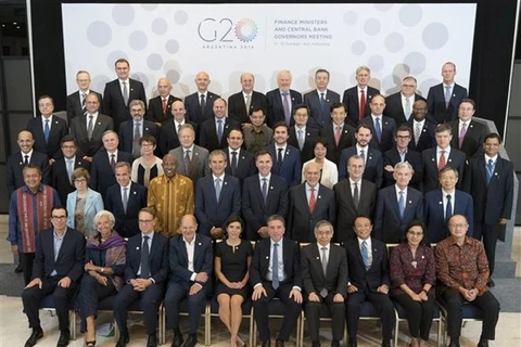 Các Bộ trưởng Tài chính và Thống đốc Ngân hàng nhóm các nền kinh tế phát triển và mới nổi (G20) chụp ảnh chung tại Hội nghị thường niên Quỹ Tiền tệ quốc tế (IMF)-Ngân hàng Thế giới (WB) tại Bali, Indonesia, ngày 12/10/2018. (Nguồn: AFP/ TTXVN)