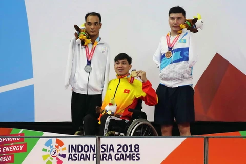 Vận động viên Võ Thanh Tùng giành Huy chương Vàng tại Asian Para Games. (Ảnh: Tấn Phúc/Vietnam+)