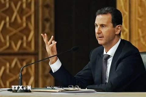 Tổng thống Syria Bashar al-Assad phát biểu trong một cuộc họp tại Damascus. (Ảnh: AFP/ TTXVN)
