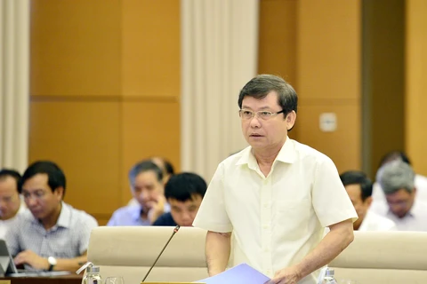 Viện trưởng Viện kiểm sát nhân dân tối cao Lê Minh Trí trình bày báo cáo công tác thi hành án. (Ảnh: Trọng Đức/TTXVN)