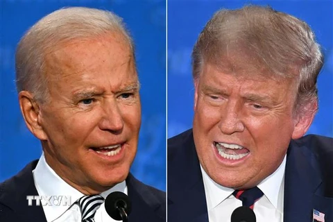 Tổng thống Mỹ Donald Trump (phải) và ứng cử viên Tổng thống của đảng Dân chủ Joe Biden (trái) tại cuộc tranh luận trực tiếp đầu tiên ở Cleveland, bang Ohio ngày 29/9/2020. (Ảnh: AFP/TTXVN)