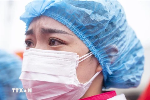 Một nữ y tá làm viêc tại bệnh viện ở Vũ Hán, tỉnh Hồ Bắc, Trung Quốc, ngày 29/3/2020. (Ảnh: THX/TTXVN)