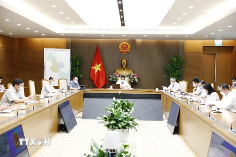 Phó Thủ tướng Vũ Đức Đam và lãnh đạo, đại diện các bộ, ngành dự họp tại Hà Nội. (Ảnh: Minh Đức/TTXVN)