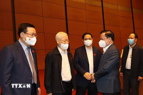 Tổng Bí thư Nguyễn Phú Trọng cùng các đồng chí lãnh đạo Đảng, Nhà nước dự Kỳ họp thứ hai, Quốc hội khóa XV. (Ảnh: Trí Dũng/TTXVN)