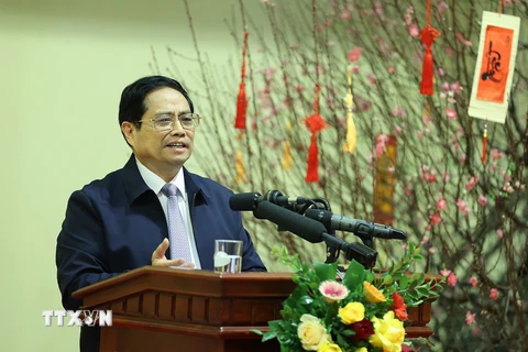 Thủ tướng Phạm Minh Chính chúc Tết và giao nhiệm vụ cho ngành ngân hàng. (Ảnh: Dương Giang/TTXVN)