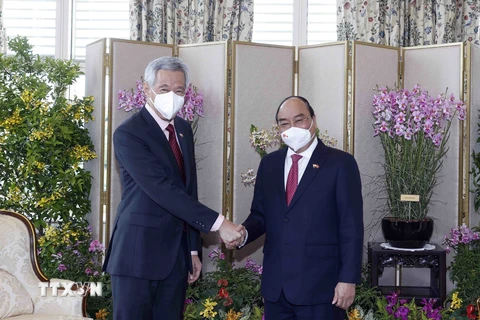 [Photo] Chủ tịch nước Nguyễn Xuân Phúc gặp Thủ tướng Singapore