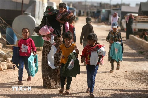 Trẻ em tại một trại tị nạn tại Dana, tỉnh Idlib, Syria. (Ảnh: AFP/TTXVN)