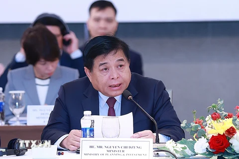 Bộ trưởng Bộ Kế hoạch và Đầu tư Nguyễn Chí Dũng phát biểu khai mạc diễn đàn. Ảnh: Dương Giang-TTXVN