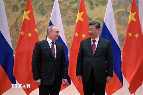Chủ tịch Trung Quốc Tập Cận Bình (phải) trong cuộc gặp Tổng thống Nga Vladimir Putin tại Bắc Kinh, ngày 4/2/2022. (AFP/TTXVN)