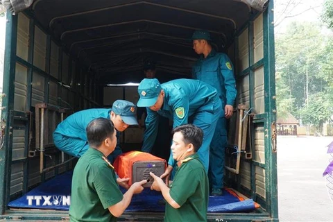 Ban Chỉ đạo 24 thị xã Bình Long tổ chức lễ bàn giao 25 hài cốt liệt sỹ vừa được phát hiện và cất bốc tại địa phương cho Bộ Chỉ huy Quân sự tỉnh Bình Phước. (Ảnh: TTXVN phát)