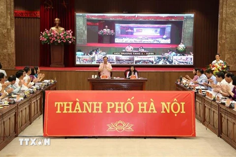Bí thư Thành ủy Hà Nội Đinh Tiến Dũng tại buổi đối thoại với Mặt trận Tổ quốc Việt Nam các cấp thành phố. (Ảnh: TTXVN)