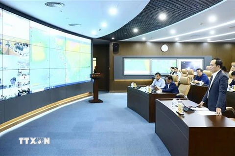 Phó Thủ tướng Trần Lưu Quang chủ trì họp trực tuyến ứng phó với mưa lũ tại Thừa Thiên Huế và các tỉnh miền Trung. (Ảnh: Lâm Khánh/TTXVN)
