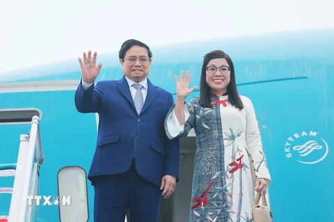 Thủ tướng Phạm Minh Chính và Phu nhân. (Ảnh: Dương Giang/TTXVN)