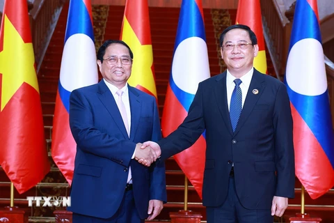 Thủ tướng Phạm Minh Chính hội kiến Thủ tướng Lào Sonexay Siphandone, Chủ tịch ASEAN 2024. (Ảnh Dương Giang/TTXVN)