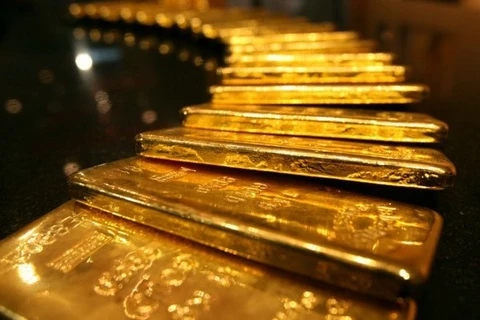 Giá vàng thế giới đi xuống dưới áp lực của đồng USD mạnh 