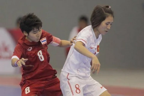 Nữ futsal Việt Nam không thể tạo nên bất ngờ. (Ảnh; Quang Nhựt/TTXVN)