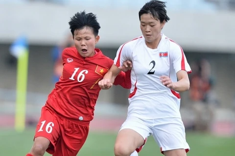 Tuyển nữ Việt Nam (áo đỏ) thua tiếc nuối trước Triều Tiên. (Nguồn: AFC)