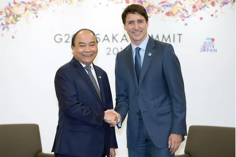 Thủ tướng Nguyễn Xuân Phúc gặp Thủ tướng Canada Justin Trudeau. (Ảnh: Thống Nhất/TTXVN)