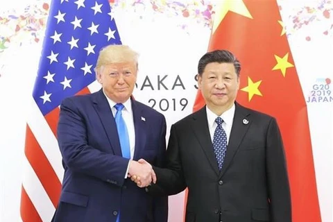 Chủ tịch Trung Quốc Tập Cận Bình (phải) và Tổng thống Mỹ Donald Trump trong cuộc gặp bên lề Hội nghị thượng đỉnh G20. (Nguồn: THX/TTXVN)