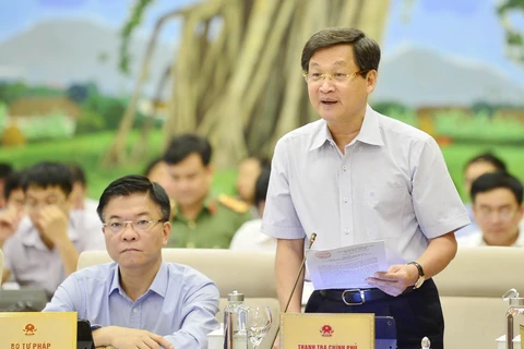 Tổng Thanh tra Chính phủ Lê Minh Khái trình bày báo cáo (tóm tắt) về công tác phòng, chống tham nhũng. (Ảnh: Trọng Đức/TTXVN)