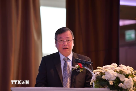 Phó Chủ tịch Ủy ban Nhân dân tỉnh Bình Phước Huỳnh Anh Minh phát biểu tại hội thảo. (Ảnh: Hữu Kiên/TTXVN)