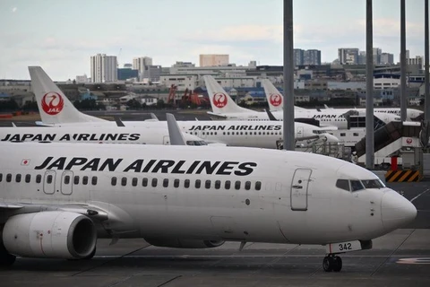 Japan Airlines (JAL) thông báo điều chỉnh giảm dự báo lợi nhuận ròng của hãng năm nay. (Nguồn: AFP)